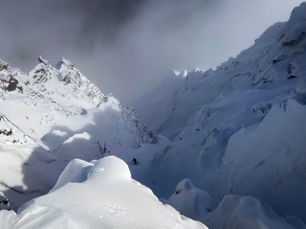 Skiing the top section of MK gully, above the mandatory air